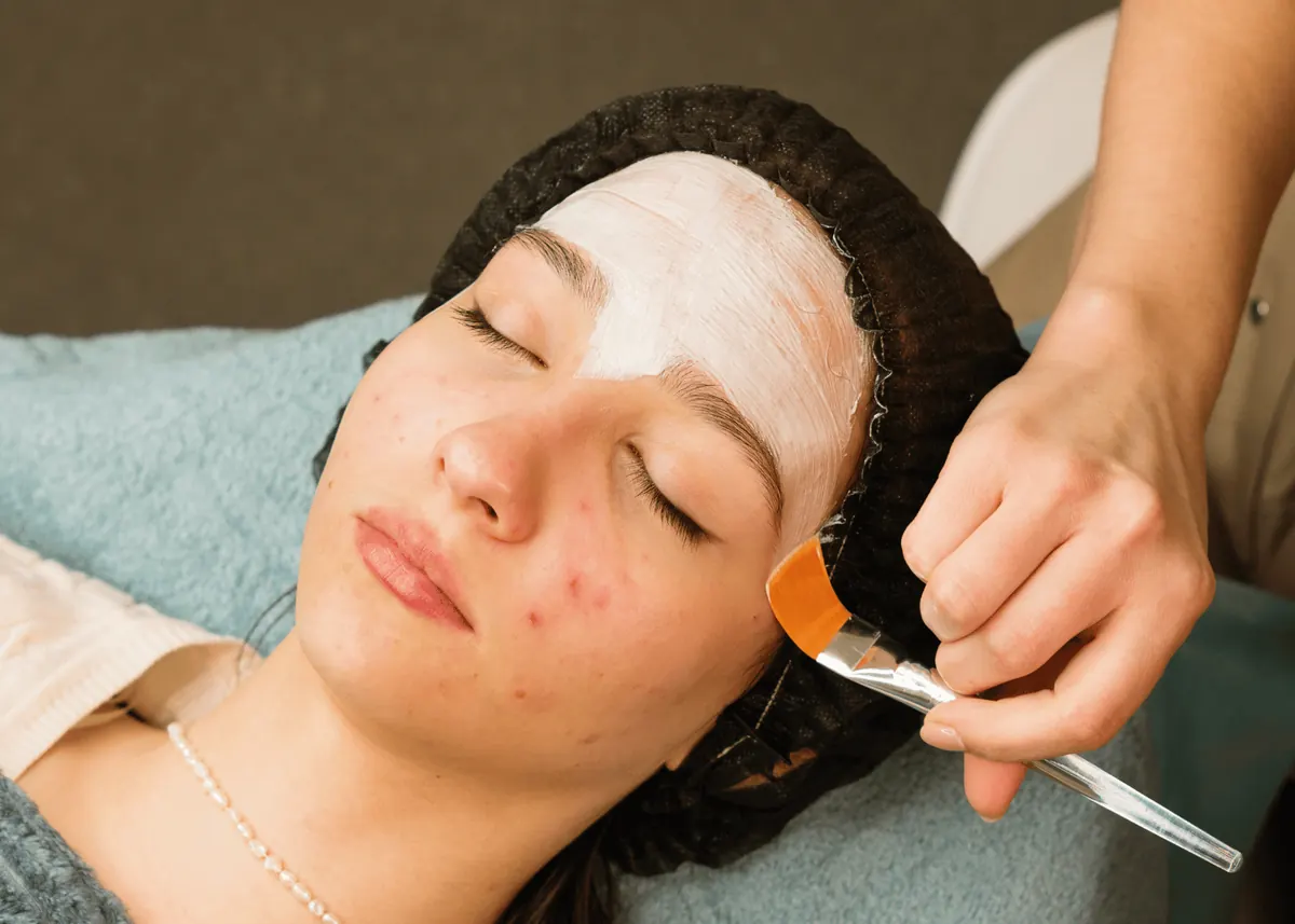 Teen receiving a professional acne skin check at Safe Haven Spa in Springville, Utah