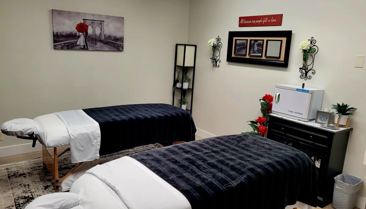 Couples massage room with side-by-side treatment beds at Safe Haven Spa in Springville, Utah