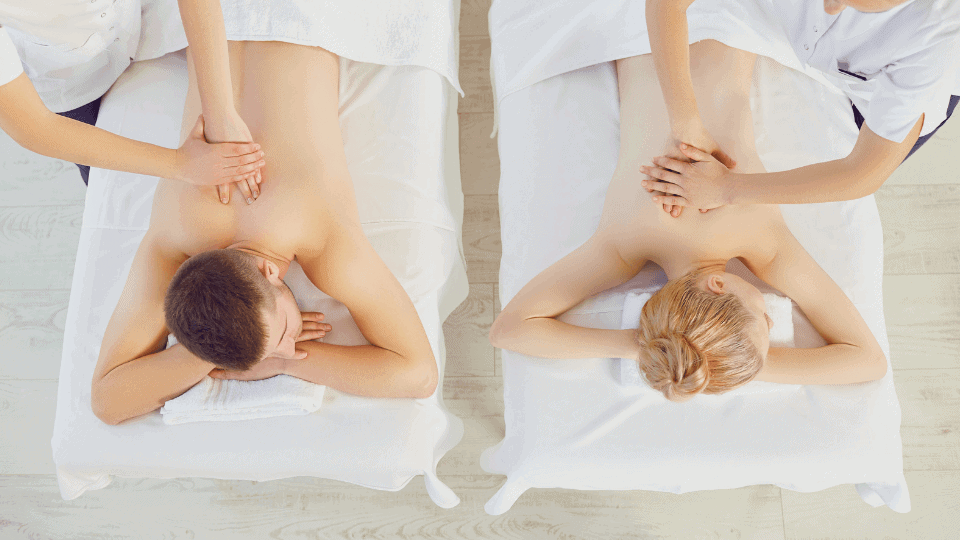 couple on a massage table face down